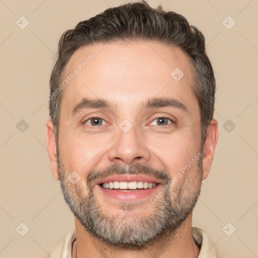 Joyful white adult male with short  brown hair and brown eyes