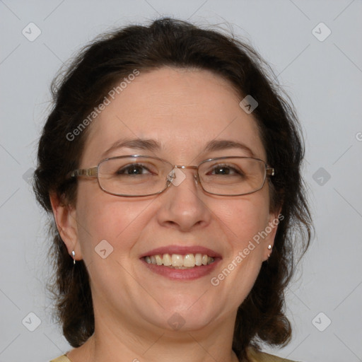 Joyful white adult female with medium  brown hair and blue eyes