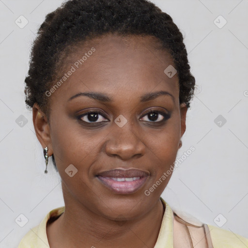 Joyful black young-adult female with short  brown hair and brown eyes