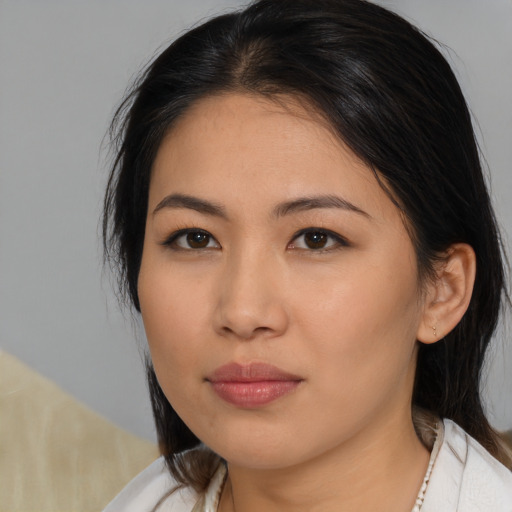 Neutral asian young-adult female with medium  brown hair and brown eyes