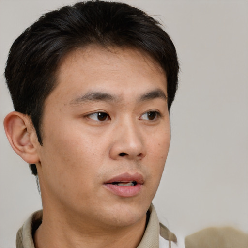 Neutral asian young-adult male with short  brown hair and brown eyes
