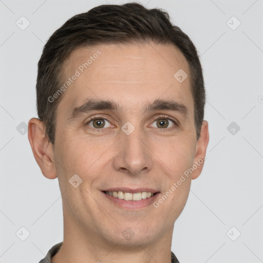 Joyful white young-adult male with short  brown hair and brown eyes