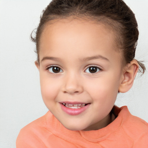 Joyful white child female with short  brown hair and brown eyes