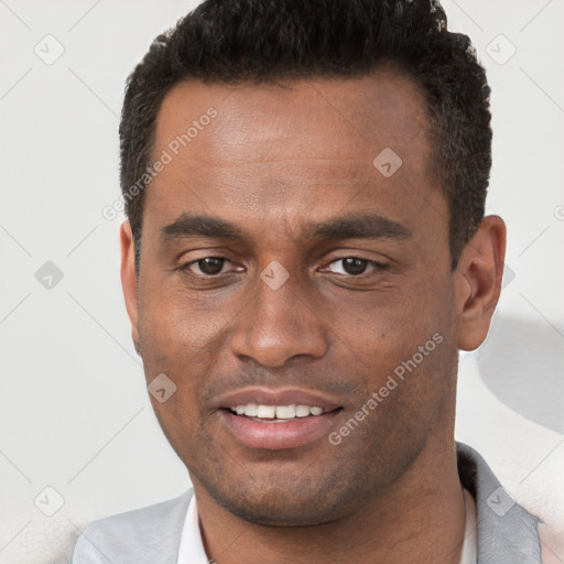 Joyful black young-adult male with short  brown hair and brown eyes