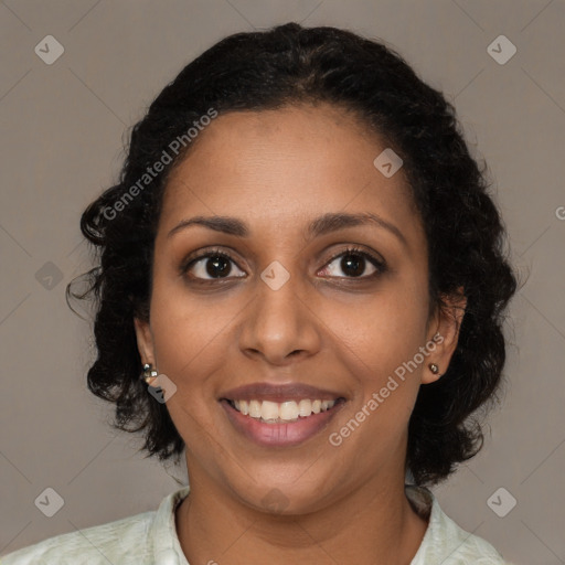 Joyful black young-adult female with medium  brown hair and brown eyes