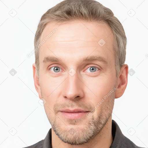 Neutral white young-adult male with short  brown hair and grey eyes