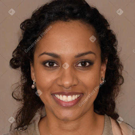 Joyful black young-adult female with long  brown hair and brown eyes