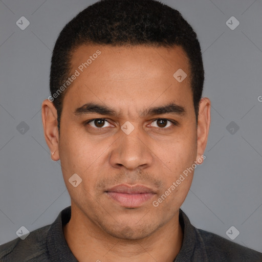 Joyful latino young-adult male with short  brown hair and brown eyes