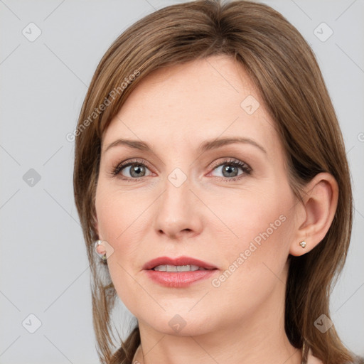 Joyful white young-adult female with medium  brown hair and grey eyes