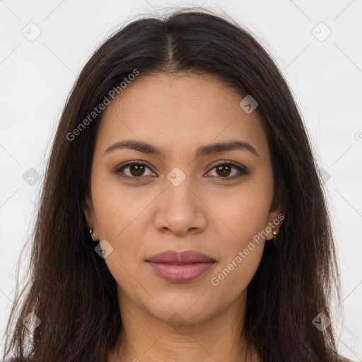 Joyful latino young-adult female with long  brown hair and brown eyes