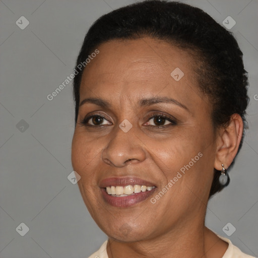 Joyful black adult female with short  brown hair and brown eyes