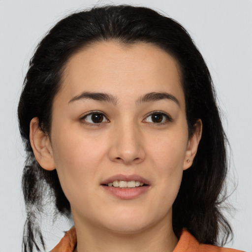 Joyful latino young-adult female with medium  brown hair and brown eyes