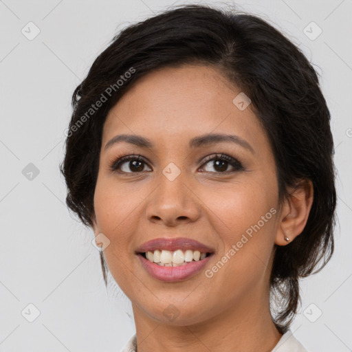 Joyful latino young-adult female with medium  brown hair and brown eyes