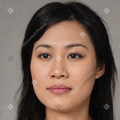 Joyful asian young-adult female with long  black hair and brown eyes