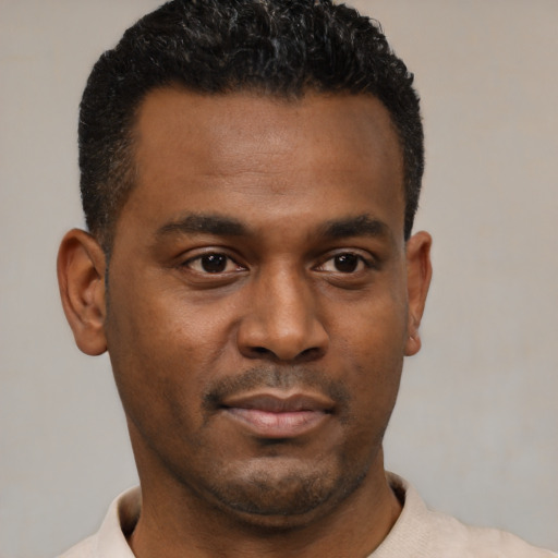 Neutral black young-adult male with short  black hair and brown eyes
