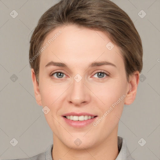 Joyful white young-adult female with short  brown hair and grey eyes