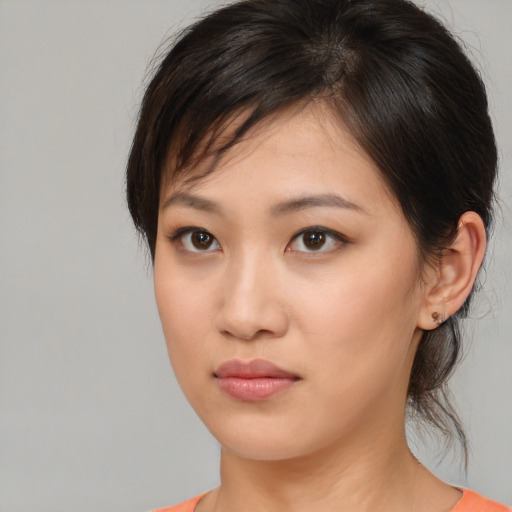 Neutral asian young-adult female with medium  brown hair and brown eyes