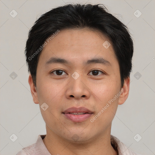 Joyful asian young-adult male with short  brown hair and brown eyes