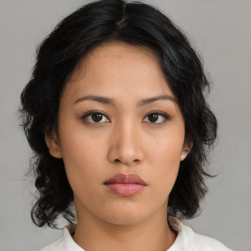 Neutral latino young-adult female with medium  black hair and brown eyes