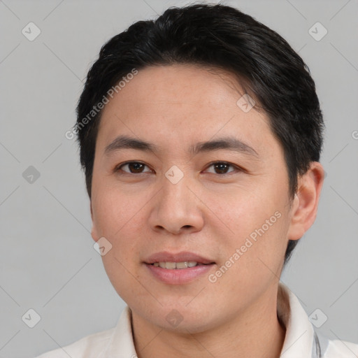 Joyful white young-adult male with short  black hair and brown eyes