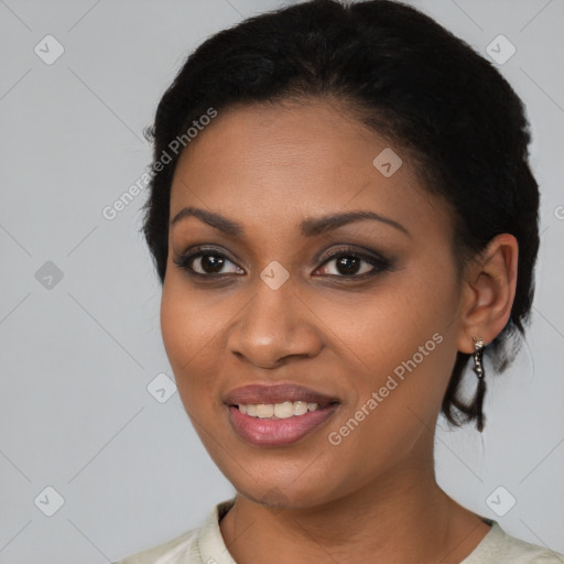 Joyful black young-adult female with medium  black hair and brown eyes