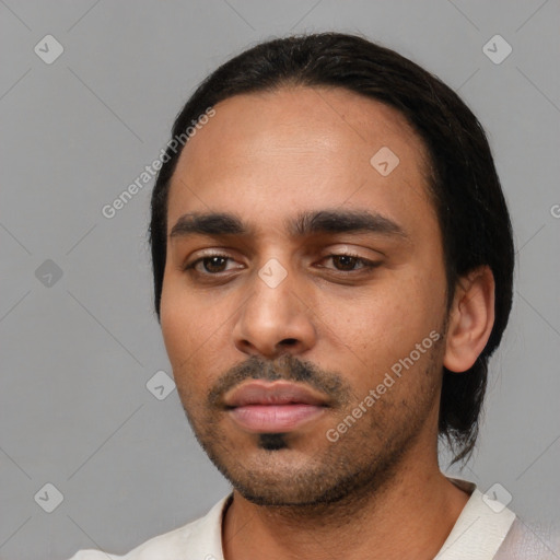 Neutral latino young-adult male with short  black hair and brown eyes