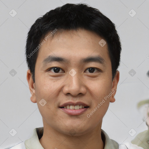 Joyful asian young-adult male with short  black hair and brown eyes