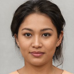 Joyful asian young-adult female with medium  brown hair and brown eyes