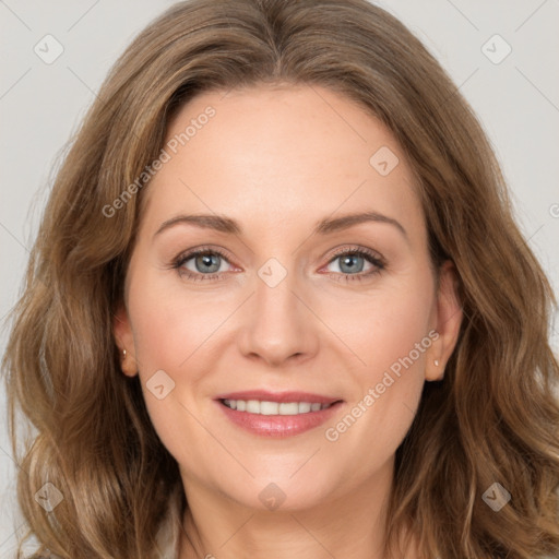 Joyful white young-adult female with long  brown hair and green eyes