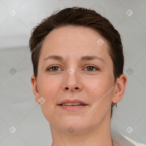 Joyful white adult female with short  brown hair and brown eyes