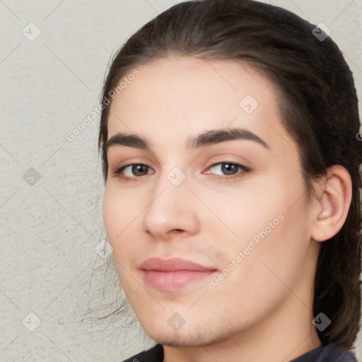 Neutral white young-adult female with long  brown hair and brown eyes