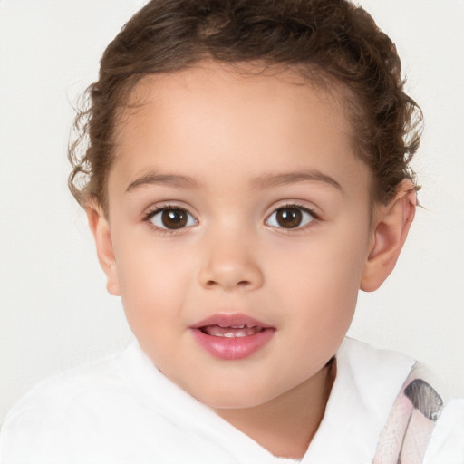 Joyful white child female with short  brown hair and brown eyes