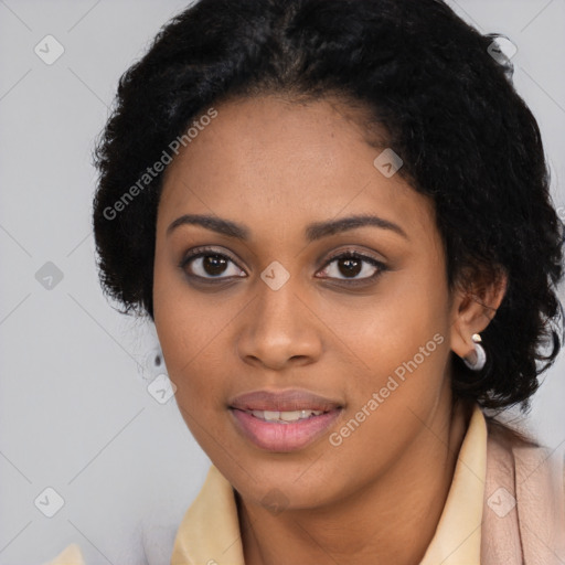 Joyful black young-adult female with long  black hair and brown eyes