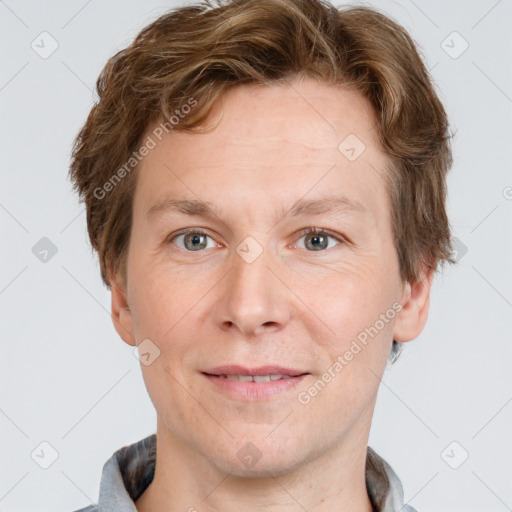 Joyful white adult male with short  brown hair and grey eyes