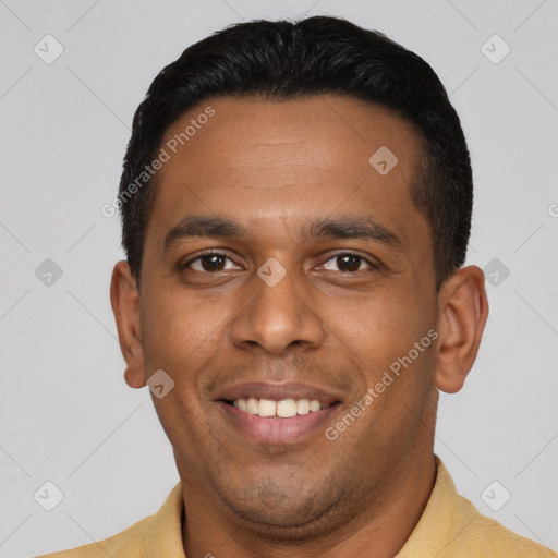 Joyful latino young-adult male with short  black hair and brown eyes