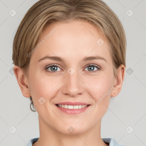 Joyful white young-adult female with short  brown hair and grey eyes