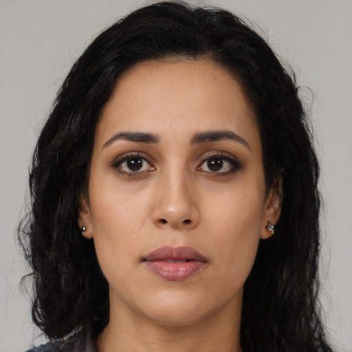Neutral latino young-adult female with long  black hair and brown eyes