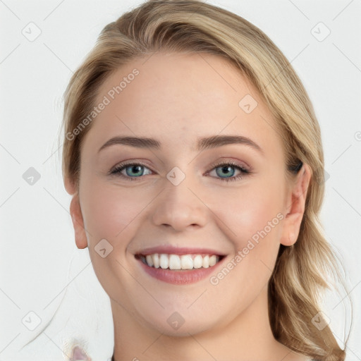 Joyful white young-adult female with long  brown hair and blue eyes