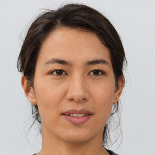 Joyful asian young-adult female with medium  brown hair and brown eyes