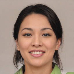 Joyful asian young-adult female with medium  brown hair and brown eyes