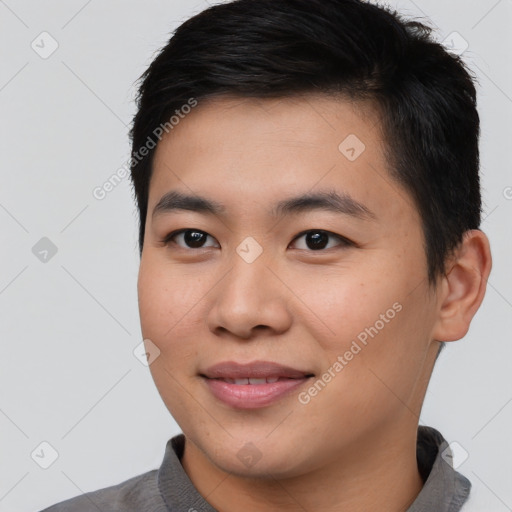 Joyful asian young-adult male with short  black hair and brown eyes