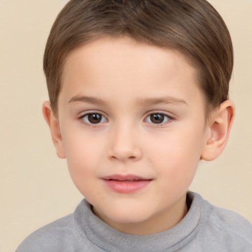 Joyful white child male with short  brown hair and brown eyes