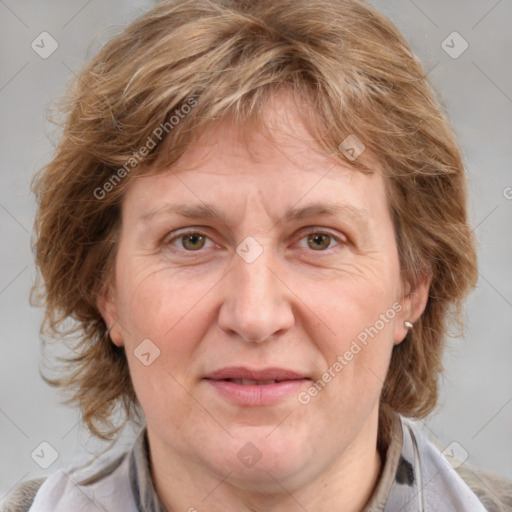 Joyful white adult female with medium  brown hair and blue eyes