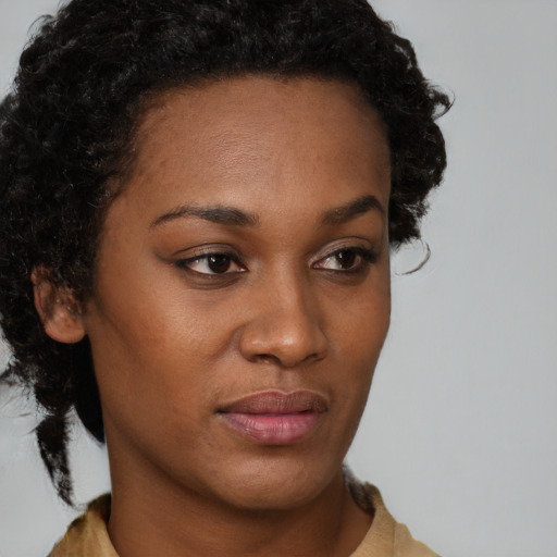Neutral black young-adult female with short  brown hair and brown eyes