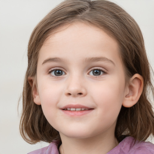 Joyful white child female with medium  brown hair and blue eyes