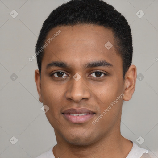 Joyful black young-adult male with short  black hair and brown eyes