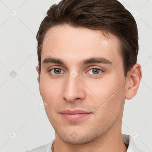 Neutral white young-adult male with short  brown hair and brown eyes