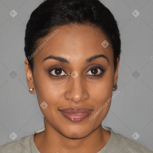 Joyful black young-adult female with short  brown hair and brown eyes