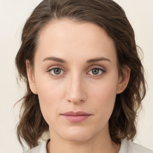 Neutral white young-adult female with medium  brown hair and green eyes