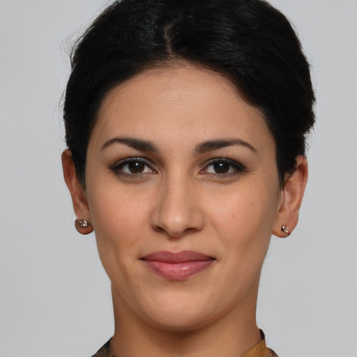 Joyful latino young-adult female with short  brown hair and brown eyes
